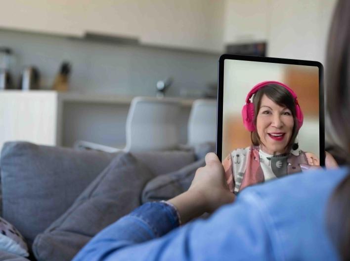 Olga talking on iPad with woman