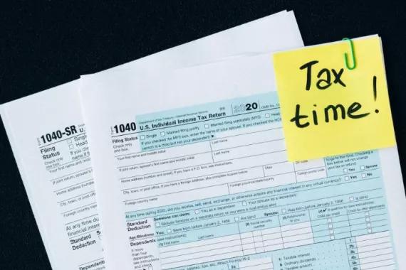 Tax papers with Memo "Tax time!"